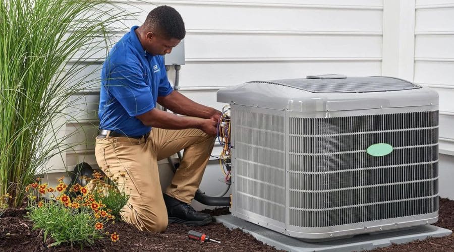 HVAC Technician Servicing AC Unit